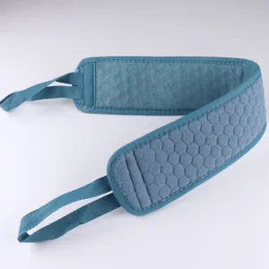 Detail view of the blue exfoliating back scrubber strap with textured honeycomb surface.