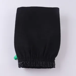 Black exfoliating bath mitt detail view, textured fabric and elastic wristband for deep cleansing.