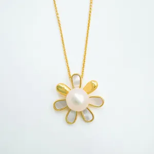 Detailed close-up of a gold flower pearl pendant necklace with mother of pearl inlay and fine chain.