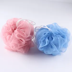 Detail shot of soft mesh bath sponges in pink and blue, perfect for daily shower lathering.