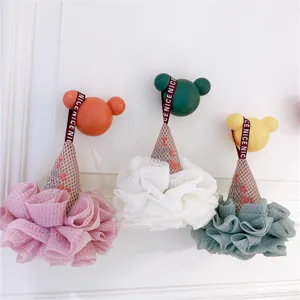 Ice cream shaped mesh bath sponge detail showing soft texture, hanging hook and ribbon design.
