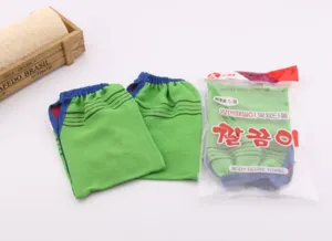 Exfoliating bamboo fiber bath gloves, double-sided fingerless design for body scrubbing detail.