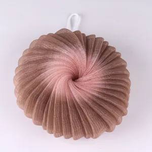 Detailed view of the soft mesh shower sponge in gradient brown, perfect for body cleansing.