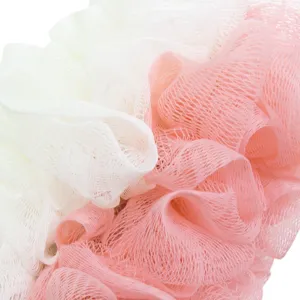 Soft mesh bath sponge in white and pink, ideal for daily shower and gentle skin exfoliation.