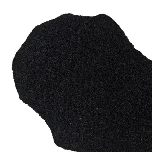 Gant de gommage exfoliant noir pour le corps, texture abrasive pour un nettoyage en douceur.