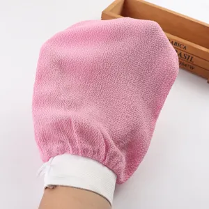 Detailed view of the pink exfoliating bath mitt with elastic wrist band and hanging loop.