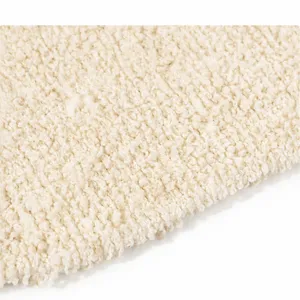 Dettaglio guanto da bagno in juta esfoliante, texture in fibra vegetale per la pulizia.