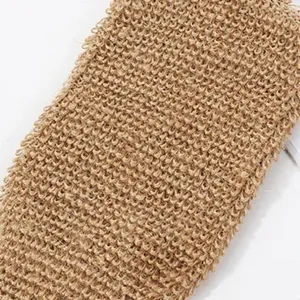 Dettaglio del guanto da bagno in juta naturale, scrub esfoliante per il corpo e spa.
