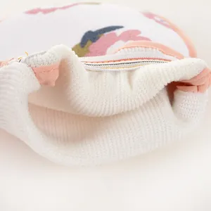 Detail shot of a double-sided printed bath mitt with zipper opening for easy use and cleaning.