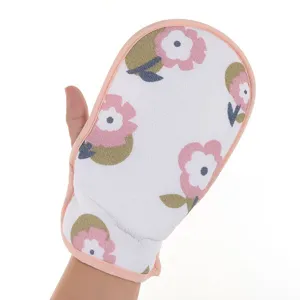 Close-up detail of the floral bath sponge mitt with soft pink border and cute flower print.