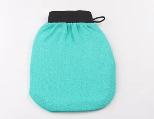 Exfoliating bath mitt detail showing the textured turquoise fabric and black elastic hanging loop.