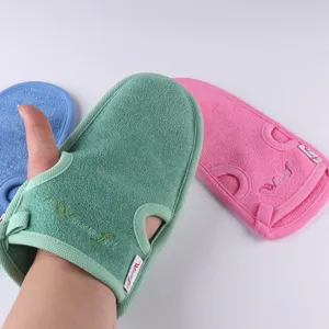 Detailed view of plant fiber exfoliating bath glove with thumb slot in solid colors.