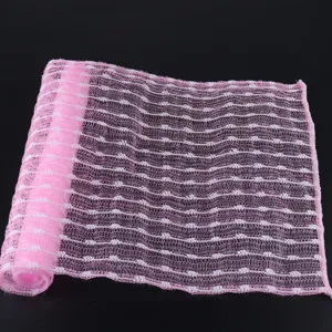 Pink white mesh bath scrubber exfoliating back towel detail view for daily bath cleaning.