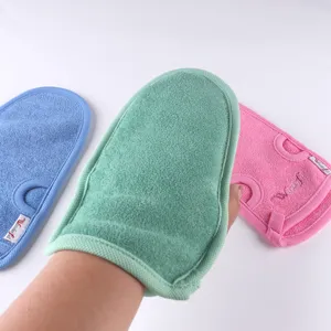 Exfoliation bath mitt detail, soft plant fiber body scrubber glove in multiple solid colors.