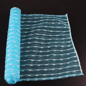 Blue and white jacquard exfoliating bath towel detail, mesh woven texture for body scrubbing.