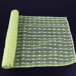 Long mesh sauna bath towel detail, showing textured green and white jacquard exfoliating fabric.