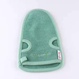 Green exfoliating bath mitt plant fiber shower glove gentle body scrubber skin care tool.