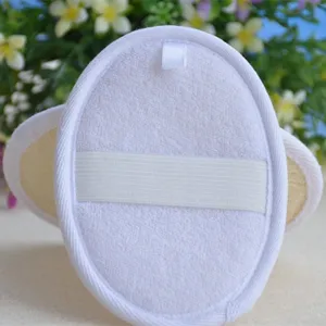 Close-up of oval bath loofah sponge pad with white elastic hand strap and hanging loop detail.