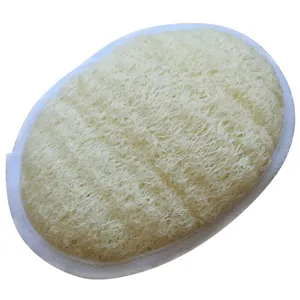 Natural loofah sponge pad detail view, organic body scrubber for gentle exfoliating bath.