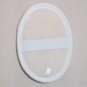 Natural loofah body scrubber detail view, oval exfoliating sponge with elastic hand strap.