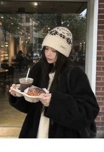 Winter warm knitted wool beanie hat for women, vintage Fair Isle snowflake pattern cap.