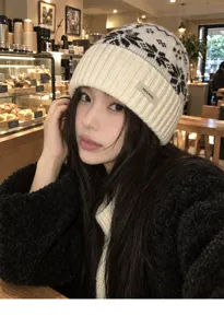 Cozy winter wool beanie hat featuring classic fair isle knit pattern, warm and stylish headwear.