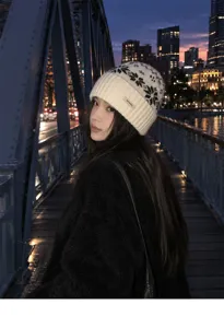 Detailed view of winter wool knit beanie featuring classic Fair Isle pattern and cozy fit.