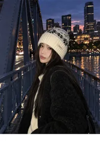 Cozy winter knit beanie hat for women featuring classic fair isle snowflake pattern and warm wool material.