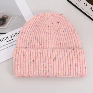 Pink knitted beanie hat with colorful speckles for cozy autumn and winter daily wear.