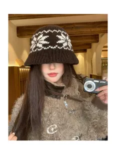 Winter warm knitted bucket hat featuring retro Fair Isle jacquard pattern in brown and white.