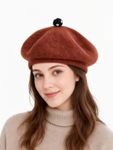 Wool beret detail shot showing texture and cute top pom-pom decoration, winter fashion hat.