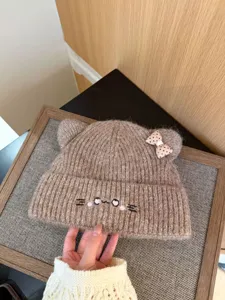 Bonito gorro de punto con orejas de gato y lazo, gorro de invierno cálido para mujeres.
