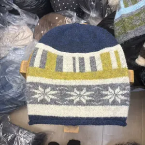 Detailed view of autumn winter jacquard knit beanie, warm wool hat with nordic snowflake.