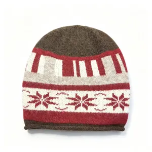 Classic winter knitted beanie hat with cozy Nordic fair isle snowflake pattern in brown and red.