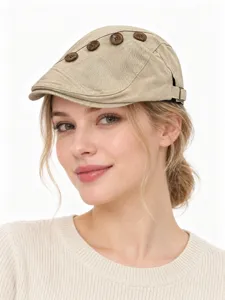 Detailed view of women's khaki cotton flat cap with button decor for autumn and winter.