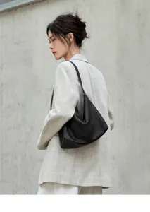 Genuine leather hobo shoulder bag for women, stylish minimalist underarm daily commute tote.