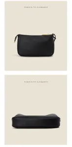 Klassieke zwarte leren schoudertas voor dames, luxe minimalistisch ontwerp met gouden hardware.