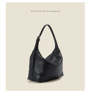 Detailed view of the black genuine leather hobo shoulder bag, elegant underarm design.