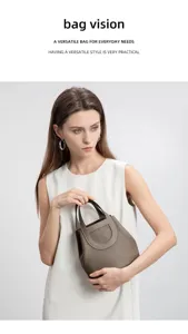 Detailed view of the premium leather bucket bag showcasing fine stitching and stylish handles.