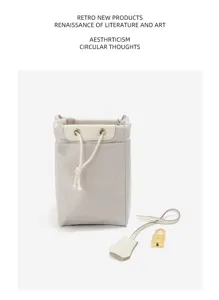 Genuine leather bucket bag with top drawstring closure, gold padlock and key clochette accessory.