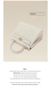 Elegante handtas van echt leer voor dames met bovenhandvat en metalen draaisluiting stijl.