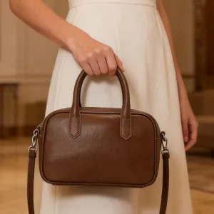 Detail view of the vintage brown leather boston bag for women, commuter handbag.