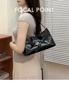 Classic black leather shoulder bag with chic metal buckle design for women elegant daily commute