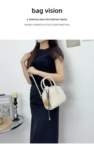 Detailed view of women's leather bowling crossbody bag, stylish white handbag for daily use.
