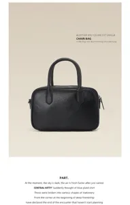 Details of the black leather boston bag showcasing fine stitching and smooth zipper closure.