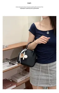 Stylish black leather bowling handbag for women with cute baseball charm niche design