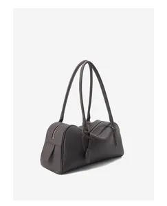 Dark brown leather bowling bag detail, minimalist shoulder bag design with long handles.