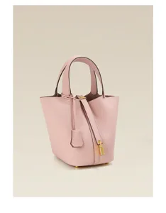Pink leather bucket handbag with top handle and metal lock detail, classic casual tote bag.