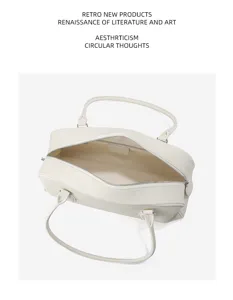 The Row style top layer leather bowling bag, minimalist Boston handbag with long shoulder strap.