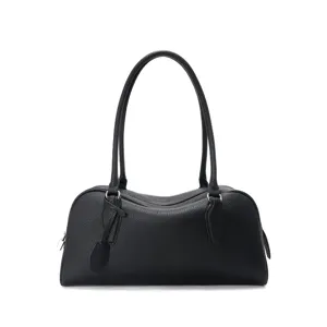 Black leather bowling bag for women, minimalist shoulder bag with long handles and top zip.